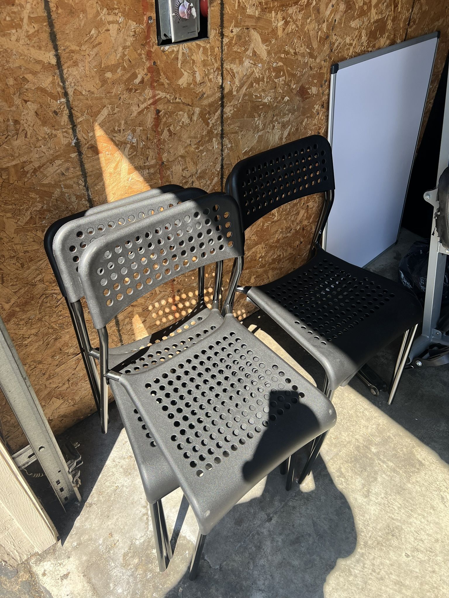 Plastic stackable chairs in black