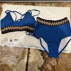 Stylish blue bikini set with colorful zigzag trim. Perfect for a day at the beach or pool. Will definitely get compliments. Size S