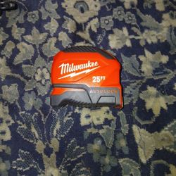 This is a Milwaukee 25ft Compact Auto-Lock Tape Measure