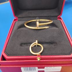Bangle  29.3  Grams 18 Karat (4,299)  Ring 8.2 Grams 18 Karat Size 6.5  (2,099)