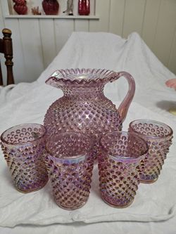 Fenton Carnival Glass hobnail pitcher with matching glasses. 