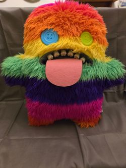ZURU Bigg Fuggler plush toy in the "Oogah Boogah" rainbow stripe design,...
