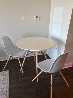 White table with set of chairs