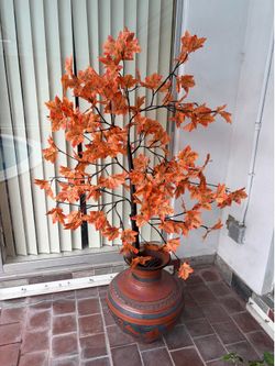Vase with beautiful tree that lits