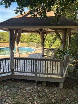 Above ground pool with gazebo and deck