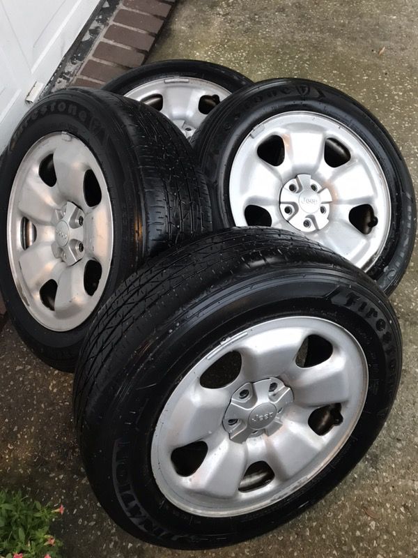 3 Jeep Cherokee wheels with used Firestone tires