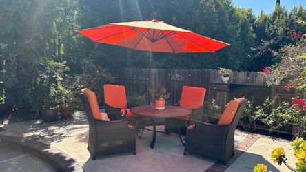 Patio furniture, Orange , 48 inch round table, 4 chairs and umbrella