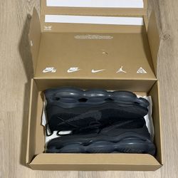 Nike Air Max Plus black trainers