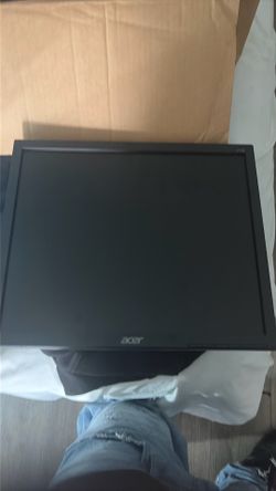 Two acer monitors and a keyboard