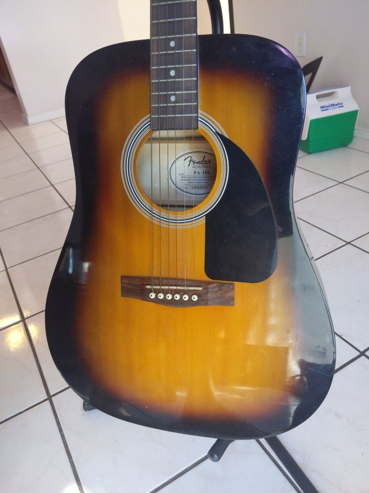 Fender acoustic guitar for sale includes bag and tripod