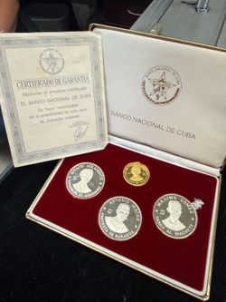 Silver and gold Cuban coins.