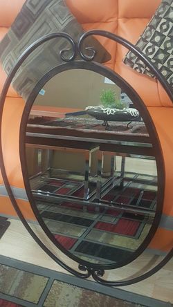 Brown metal oval shape mirror