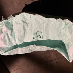 Light green inflatable baby bathtub. 