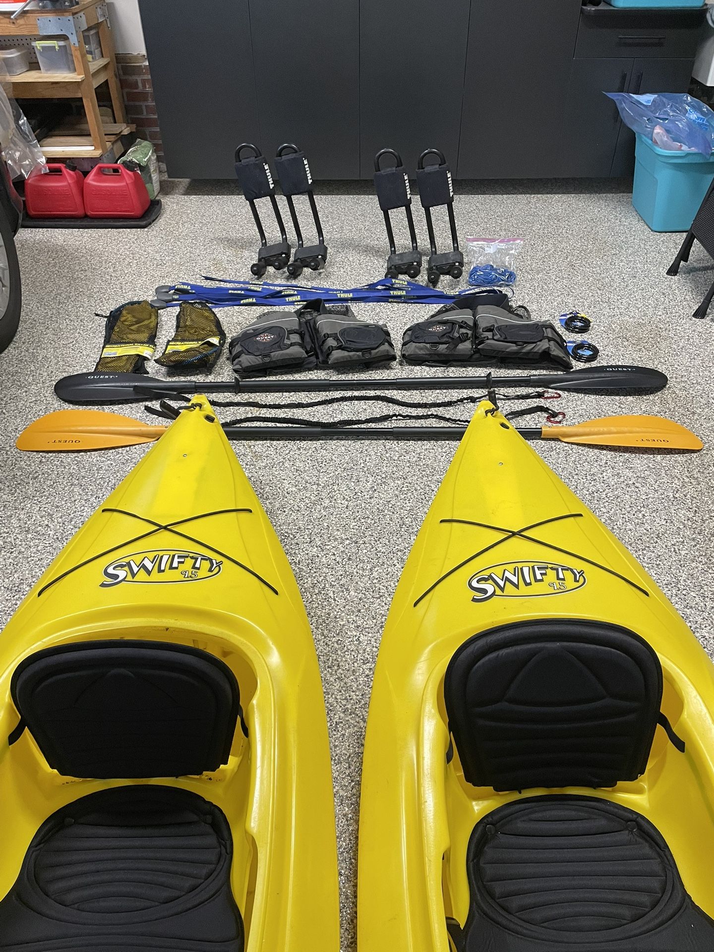 Perception SWIFTY 9.5 Kayaks with Quest Paddles and leashes, Thule Car Top Kayak Carriers and tie downs