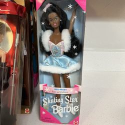 1995 Wal-Mart Special Edition Skating Star Barbie doll with a brunette hair color.  The doll wears a light blue skating outfit with a white faux-fur c