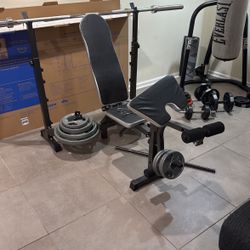 Home Gym Bench w/ Barbell & 260lbs of Weights (Needs Stabilizing)