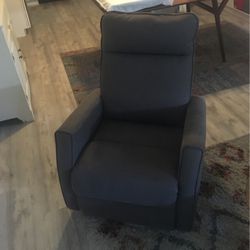 Living Spaces Glider Swivel Rocking Chair. Reclines