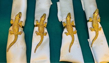 Gorgeous rhinestone encrusted alligator napkin rings with brass rings.
