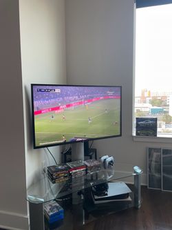 Curved Glass Pedestal TV Stand