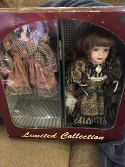 12 inch genuine porcelain doll with wardrobe trunk and extra dresses and shoes