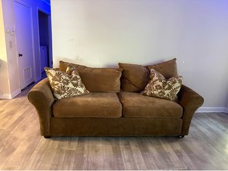 Brown couch and love seat
