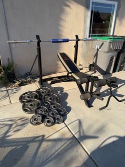 Bench press/ squat rack with 7ft 45lbs bar and 205lbs of Olympic weights