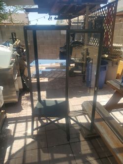 Curious  Cabinet ,metal And glass  5 ft Tall I ASK  $55.00 cash.