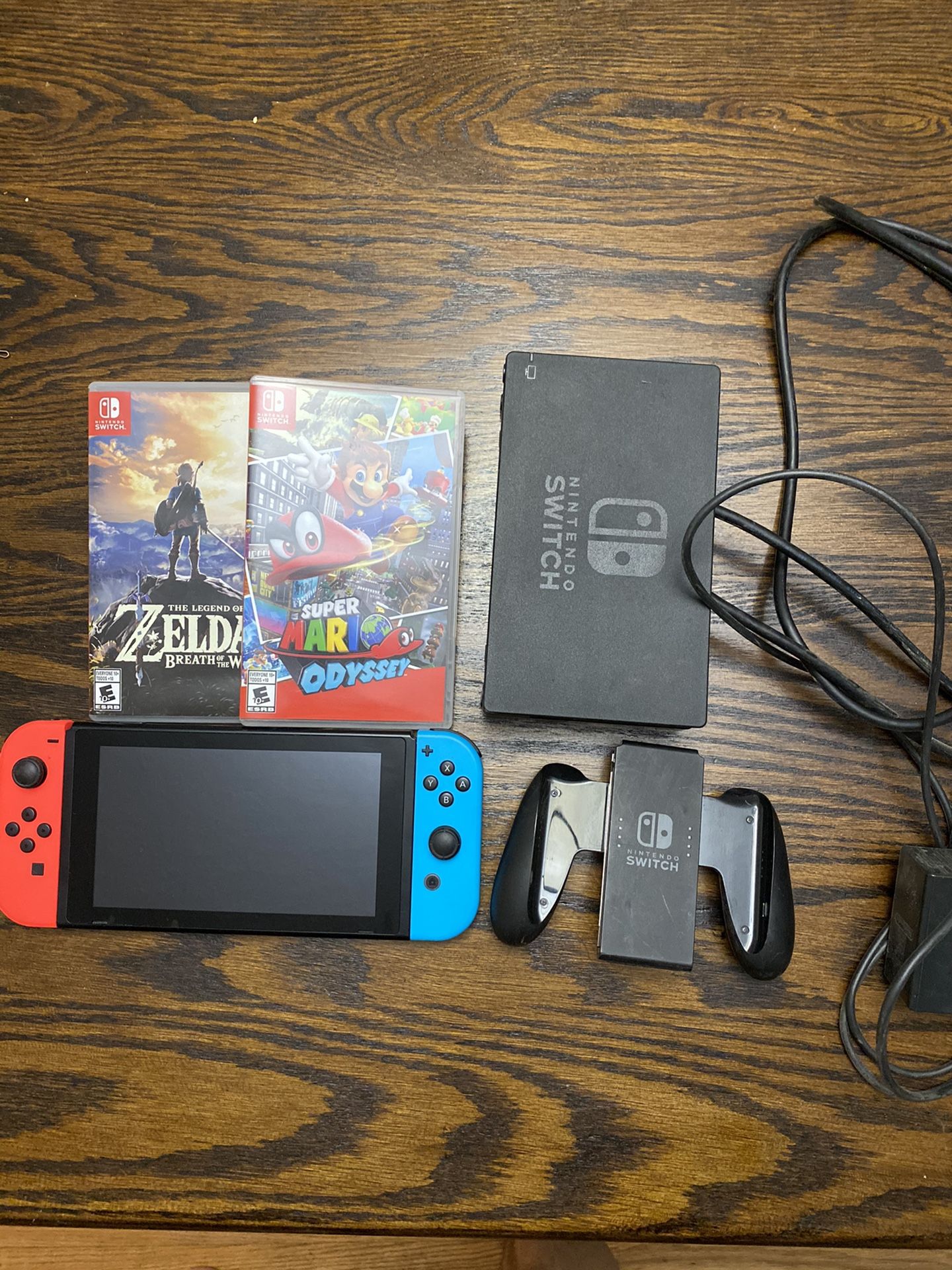 Nintendo Switch with Zelda BOTW and Super Mario Odyssey