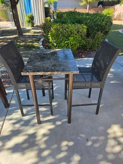 High top table and two chairs
