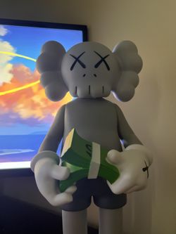 Kaws Statue With Money