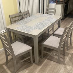 Wooden table with six chairs like now