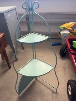 Folding metal shelf
