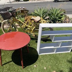 Free Girls Bicycle, White Wall Cabinet And Red Table