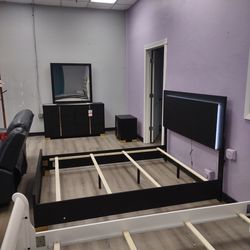 Four piece queen bedroom set with queen bed frame dresser mirror and night stand