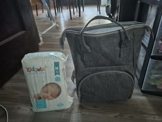 Diaper bag and pack of diapers