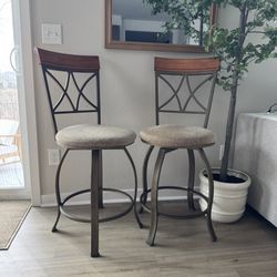 Pair Of Cushioned Swivel Barstools