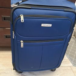 Carrion Samsonite rolling suitcase 23” Blue/black 