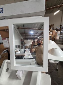 White framed wall mirror with a wood-style frame. This Luxhonez mirror, model WMFZ-6181-WH, has a rectangular shape and a clean, minimalist design.