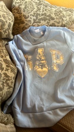This is a light blue Gap Kids sweatshirt