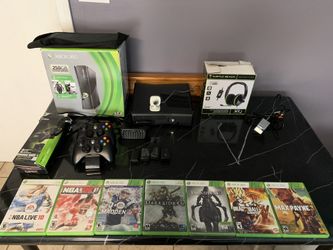 XBOX 360 with multiple accessories and games.