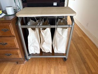 Clothing hamper with ironing board free