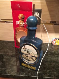 Vintage James Beam bottle with painting on it