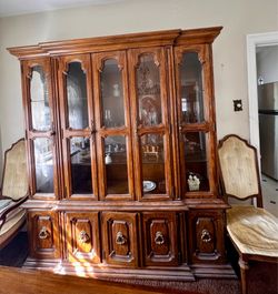 Dining room table with 4 chairs and china.