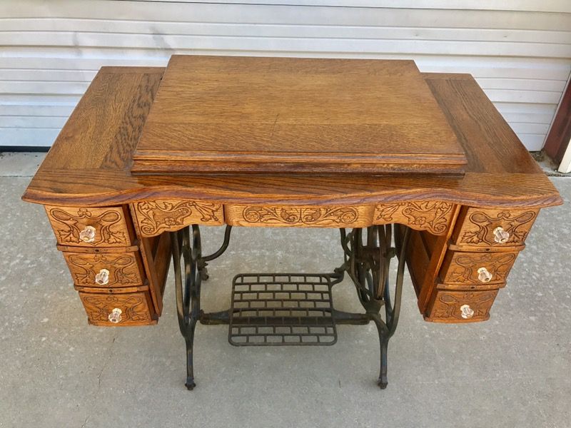 BRUNSWICK TREADLE SEWING MACHINE / WROUGHT IRON BASE / CARVED OAK CABINET
