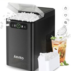 The Aeitto nugget ice maker, model CB24M-D, is a sleek black countertop ice maker that has a capacity of 1.8Ibs. This compact appliance produces ice r