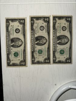 three two-dollar bills