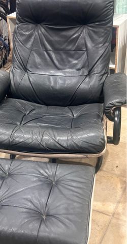 Leather chair with footstool