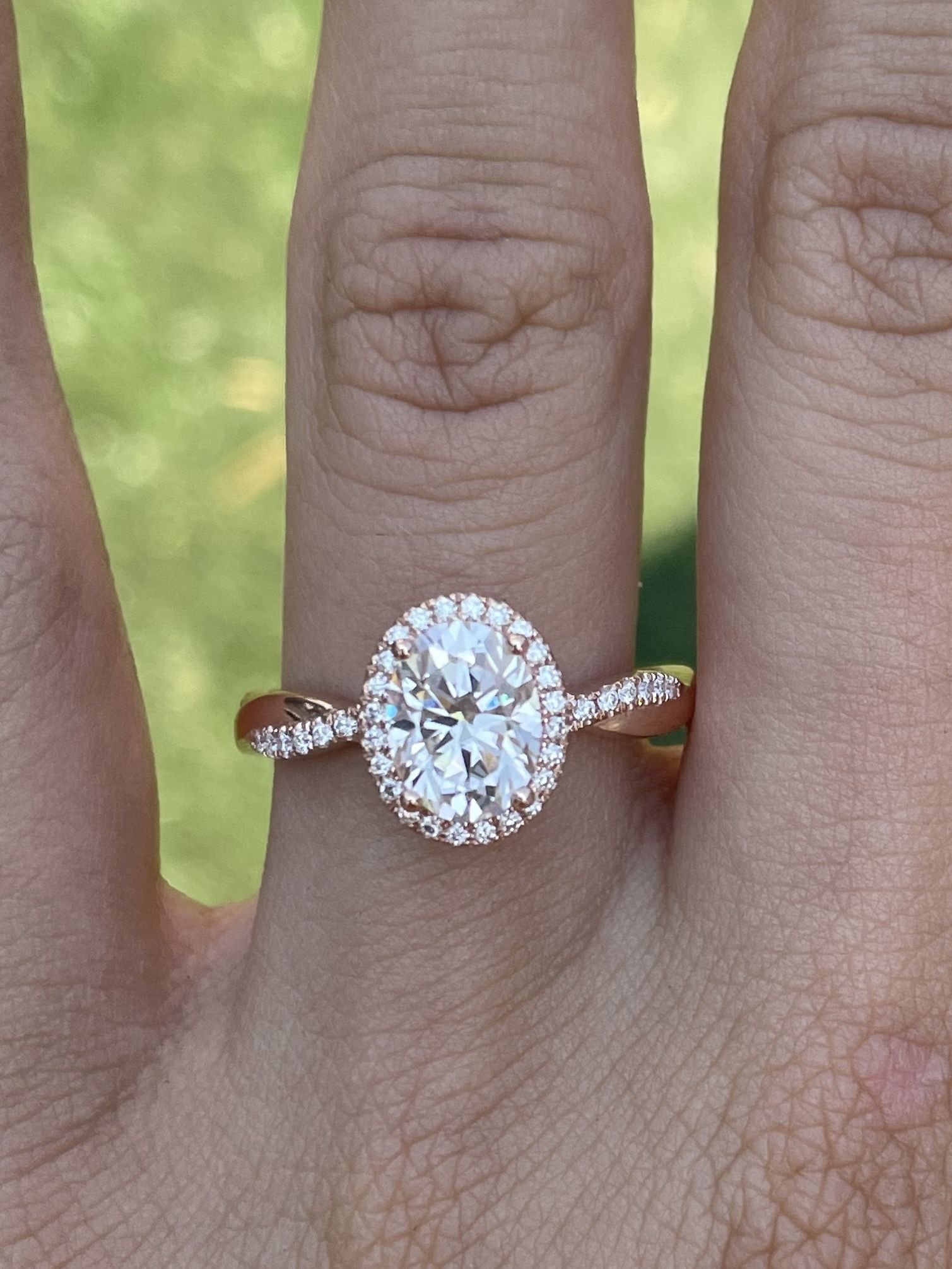 1.5 carat oval Moissanite Diamond Engagement Ring with halo on a twisted pavé band 14k