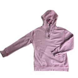 Cozy pink hooded sweatshirt with front pocket and half-zip design. Runs small!