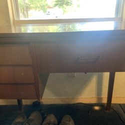 Antique Sewing Machine In Table.